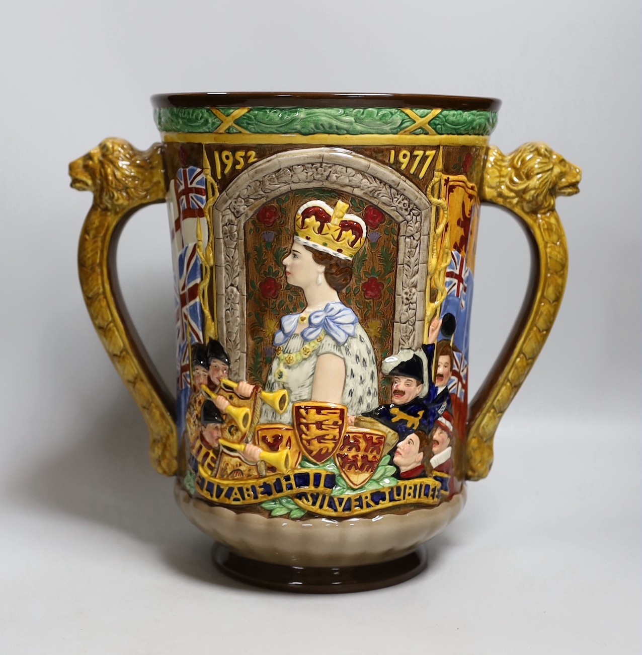 A Royal Doulton Elizabeth II silver jubilee commemorative loving cup, 1977, limited edition number 112 of 250, 27cm tall